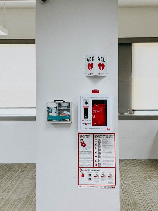 MYHeart AED in a wall cabinet with AED signage, installed on site