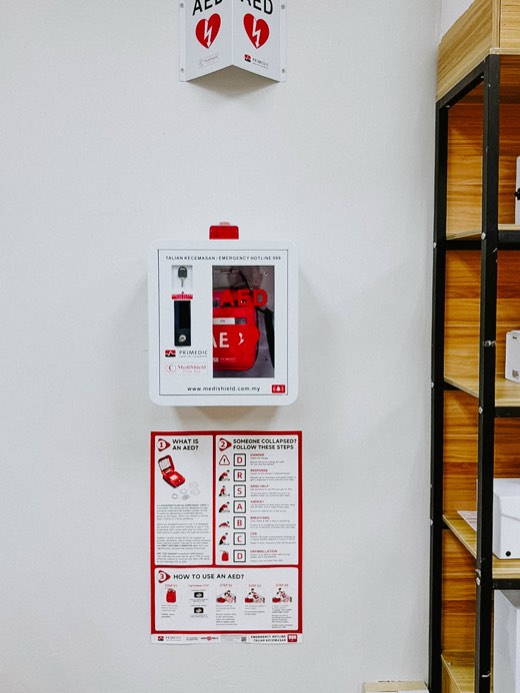 MYHeart AED in a wall cabinet with AED signage, installed on site