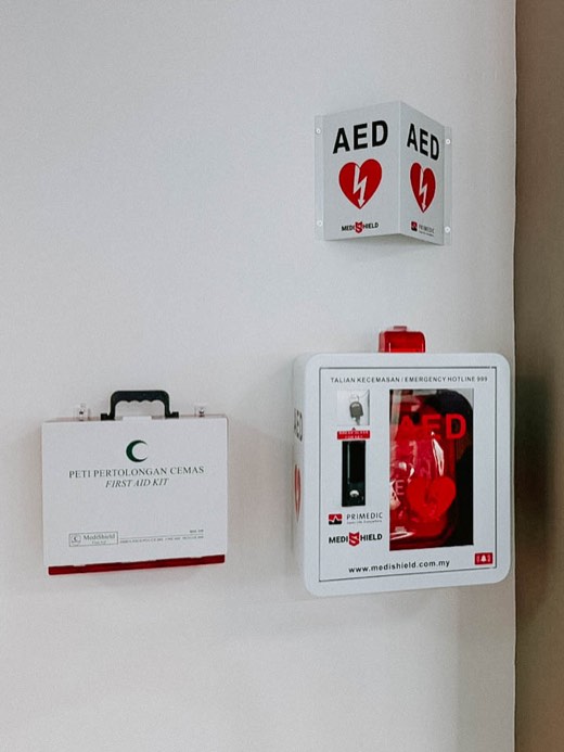 MYHeart AED in a wall cabinet with AED signage, installed on site